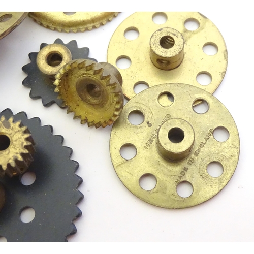 1495 - Toys: A quantity of Meccano, to include gears, brackets, wheels, struts, plates, bolts, nuts, etc. T... 