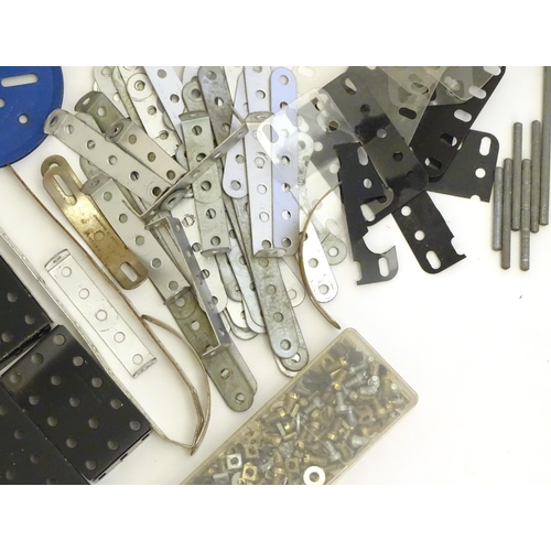 1495 - Toys: A quantity of Meccano, to include gears, brackets, wheels, struts, plates, bolts, nuts, etc. T... 