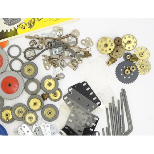 1495 - Toys: A quantity of Meccano, to include gears, brackets, wheels, struts, plates, bolts, nuts, etc. T... 