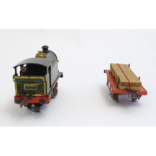 1497 - Toys: A quantity of Hornby Meccano O gauge trains and railway accessories comprising a 0-4-0 Great W... 