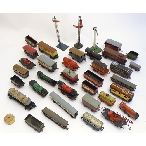 1499 - Toys: A quantity of assorted Hornby Meccano O and OO gauge rolling stock / trains and railway access... 