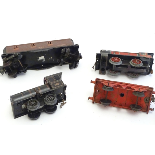 1499 - Toys: A quantity of assorted Hornby Meccano O and OO gauge rolling stock / trains and railway access... 