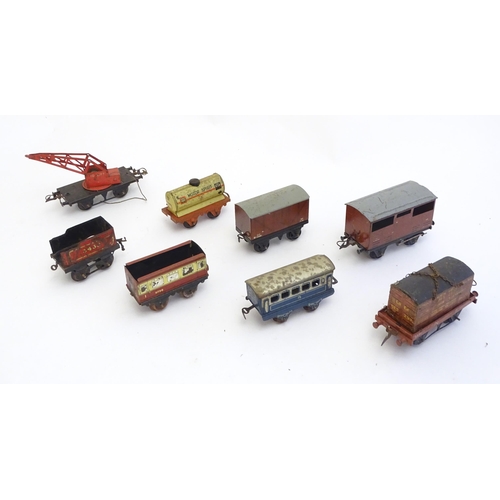 1499 - Toys: A quantity of assorted Hornby Meccano O and OO gauge rolling stock / trains and railway access... 