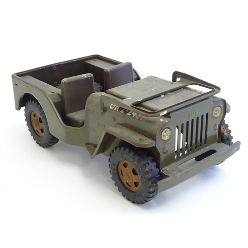 1505 - Toys: A Tonka Military / army Jeep truck, no. 251. Together with a Palitoy Action Man solider in uni... 