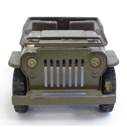 1505 - Toys: A Tonka Military / army Jeep truck, no. 251. Together with a Palitoy Action Man solider in uni... 