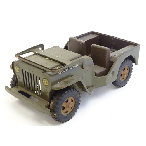 1505 - Toys: A Tonka Military / army Jeep truck, no. 251. Together with a Palitoy Action Man solider in uni... 