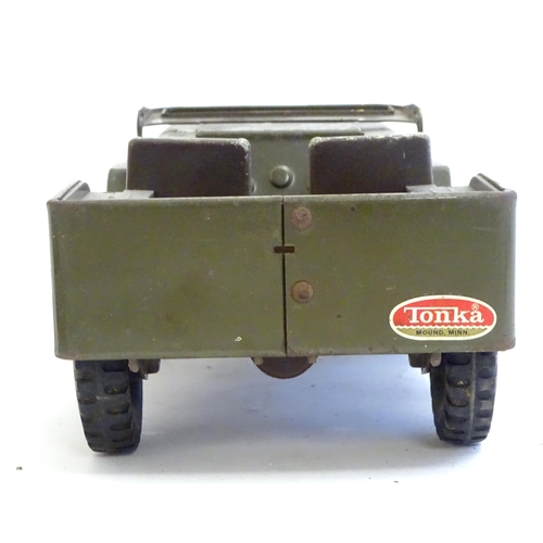 1505 - Toys: A Tonka Military / army Jeep truck, no. 251. Together with a Palitoy Action Man solider in uni... 