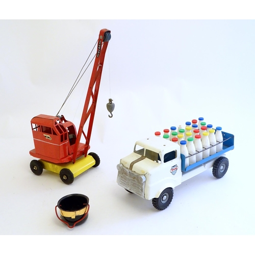 1516 - Toys: A tinplate Triang Hi-way Milk Float / truck with milk bottles, boxed. Together with a Tri-ang ... 