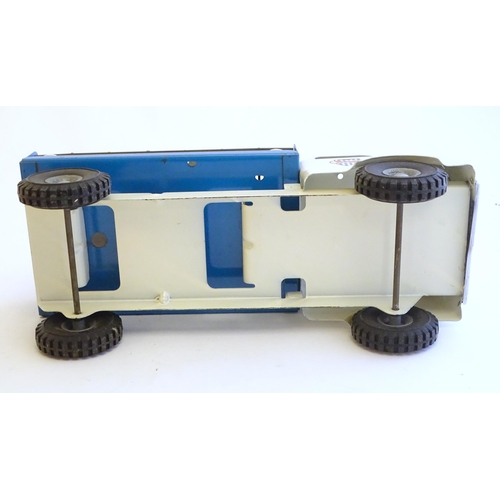 1516 - Toys: A tinplate Triang Hi-way Milk Float / truck with milk bottles, boxed. Together with a Tri-ang ... 