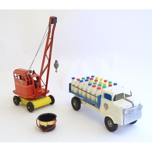 1516 - Toys: A tinplate Triang Hi-way Milk Float / truck with milk bottles, boxed. Together with a Tri-ang ... 