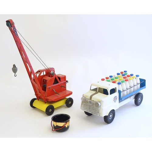 1516 - Toys: A tinplate Triang Hi-way Milk Float / truck with milk bottles, boxed. Together with a Tri-ang ... 