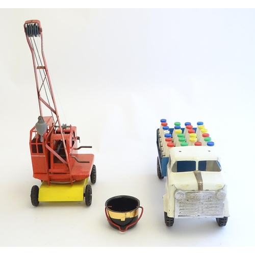 1516 - Toys: A tinplate Triang Hi-way Milk Float / truck with milk bottles, boxed. Together with a Tri-ang ... 