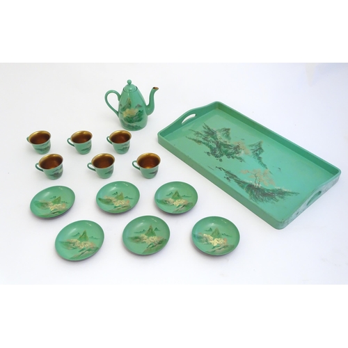 1516A - Toys: A Japanese green lacquer coffee wares comprising coffee pot, six cups and saucers and a rectan... 