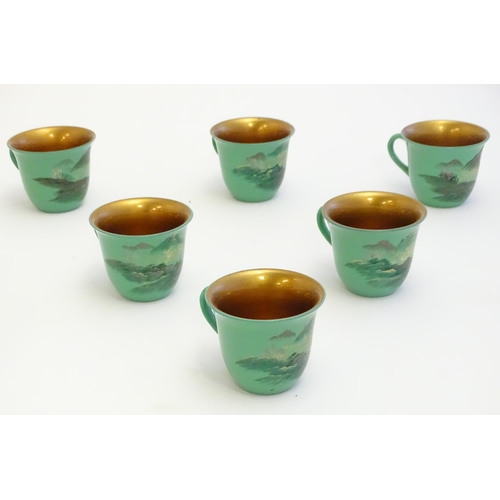 1516A - Toys: A Japanese green lacquer coffee wares comprising coffee pot, six cups and saucers and a rectan... 