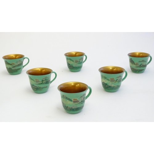 1516A - Toys: A Japanese green lacquer coffee wares comprising coffee pot, six cups and saucers and a rectan... 