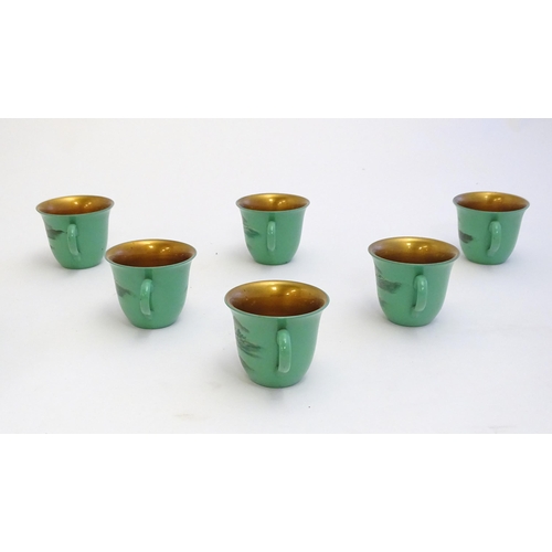 1516A - Toys: A Japanese green lacquer coffee wares comprising coffee pot, six cups and saucers and a rectan... 