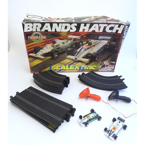 1528 - Toys: A Brands Hatch scalextrics set to include Parmalat Brabham BT49, Saudia Leyland Williams FW07B... 