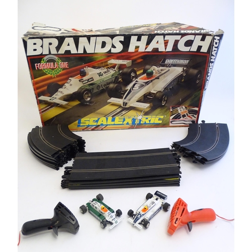 1528 - Toys: A Brands Hatch scalextrics set to include Parmalat Brabham BT49, Saudia Leyland Williams FW07B... 