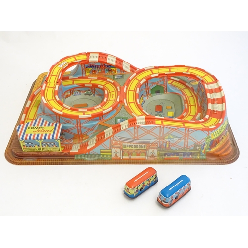 1529 - Toys: A Technofix rollercoaster / funfair game Coney Island, no. 307 with two tinplate clockwork car... 