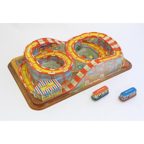 1529 - Toys: A Technofix rollercoaster / funfair game Coney Island, no. 307 with two tinplate clockwork car... 