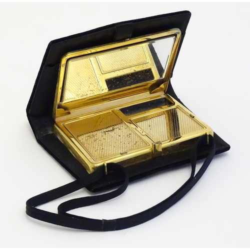 1566 - A mid 20thC ladies bag / purse formed compact opening to reveal mirror and hinged compartments withi... 