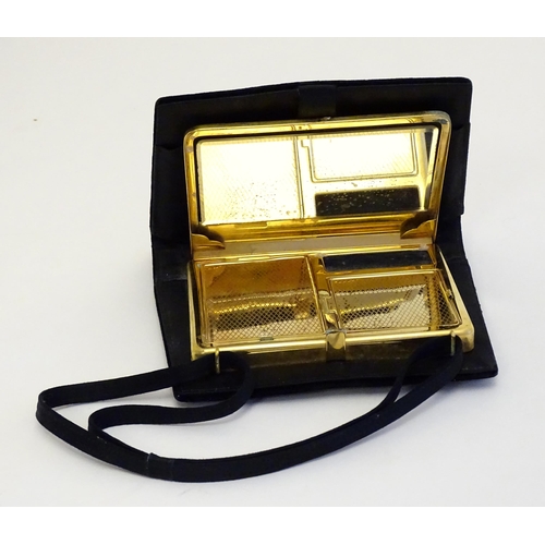 1566 - A mid 20thC ladies bag / purse formed compact opening to reveal mirror and hinged compartments withi... 