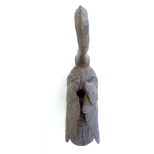 1250A - A 20thC black forest style carved pen holder modelled as a swan with an articulated neck. Approx. 4 ... 