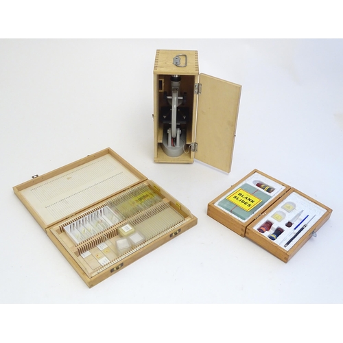 1259 - A 20thC educational microscope, together with quantity of blank slides, prepared slides and slide pr... 