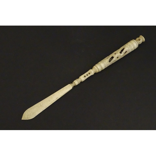 1260A - A Victorian bone letter opener / pen / stanhope with carved and pierced detail, the stanhope depicti... 