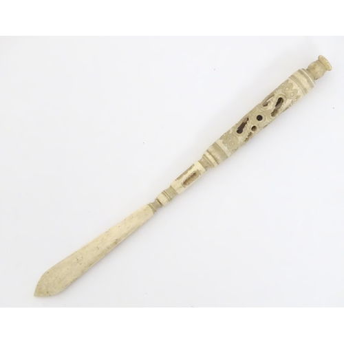 1260A - A Victorian bone letter opener / pen / stanhope with carved and pierced detail, the stanhope depicti... 