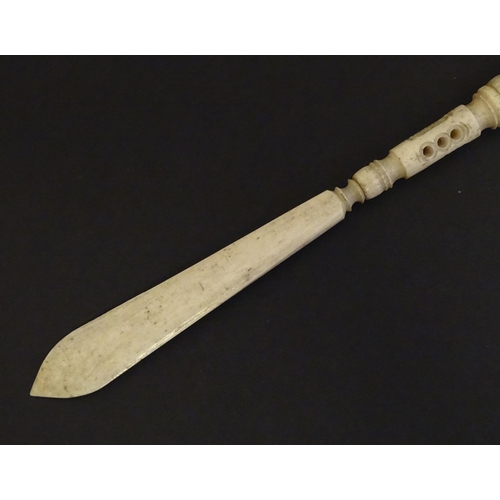 1260A - A Victorian bone letter opener / pen / stanhope with carved and pierced detail, the stanhope depicti... 