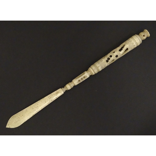 1260A - A Victorian bone letter opener / pen / stanhope with carved and pierced detail, the stanhope depicti... 