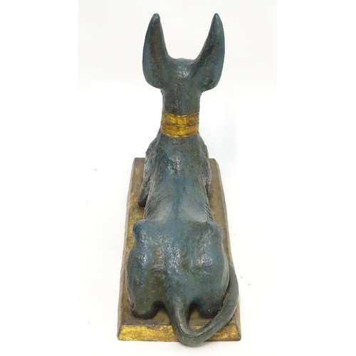 1346 - A 20thC cast terracotta model of the Egyptian deity / god Anubis, formed as a jackal dog on a rectan... 