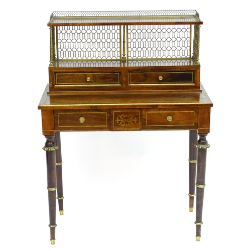 2090 - A Regency period rosewood bonheur du jour attributed to John Mclean, having a pierced brass gallery ... 