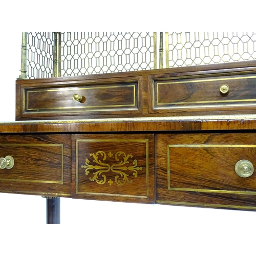 2090 - A Regency period rosewood bonheur du jour attributed to John Mclean, having a pierced brass gallery ... 