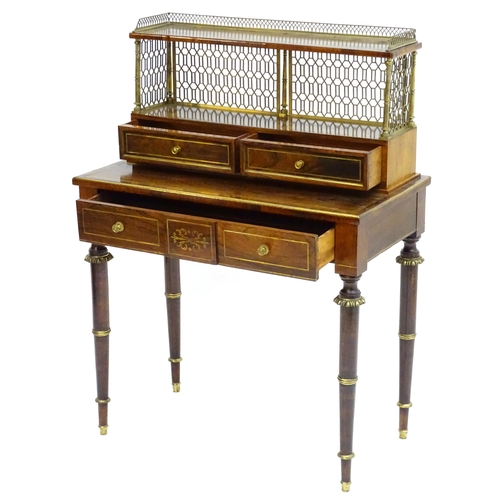 2090 - A Regency period rosewood bonheur du jour attributed to John Mclean, having a pierced brass gallery ... 