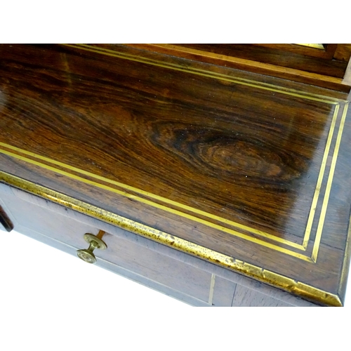 2090 - A Regency period rosewood bonheur du jour attributed to John Mclean, having a pierced brass gallery ... 