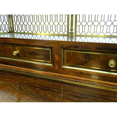 2090 - A Regency period rosewood bonheur du jour attributed to John Mclean, having a pierced brass gallery ... 