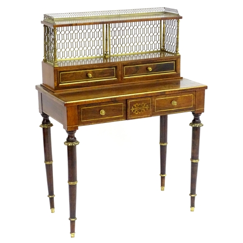 2090 - A Regency period rosewood bonheur du jour attributed to John Mclean, having a pierced brass gallery ... 