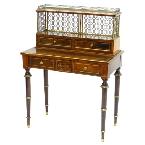 2090 - A Regency period rosewood bonheur du jour attributed to John Mclean, having a pierced brass gallery ... 