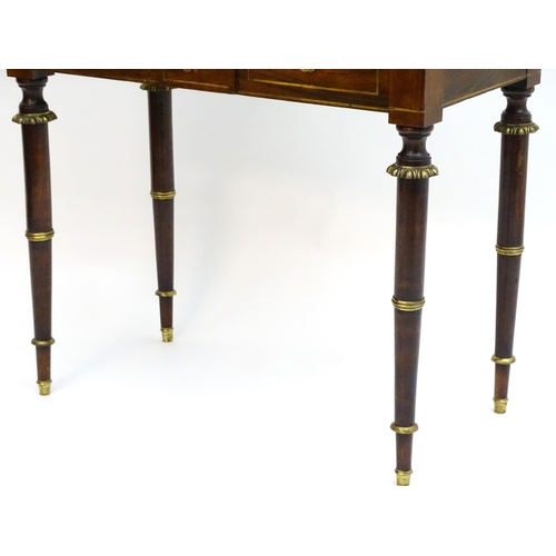 2090 - A Regency period rosewood bonheur du jour attributed to John Mclean, having a pierced brass gallery ... 