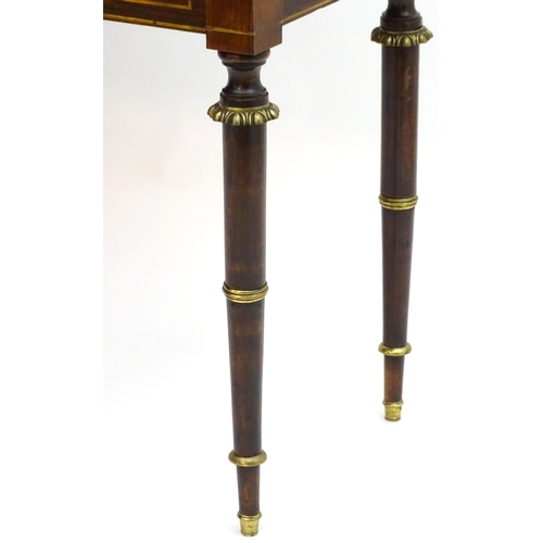 2090 - A Regency period rosewood bonheur du jour attributed to John Mclean, having a pierced brass gallery ... 