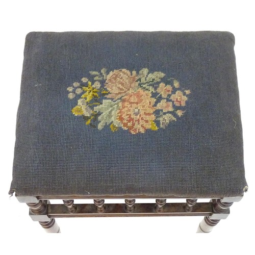 2112 - An Edwardian piano stool with floral needlework top with turned finial supports above four turned ta... 