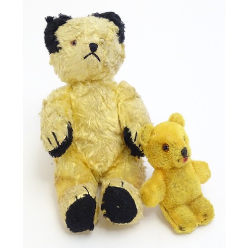 1480 - Toys: An early 20thC teddy bear with a stitched nose and paws and articulated limbs. Together with a... 