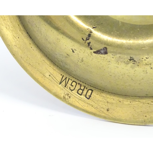 1180A - An early 20thC Continental novelty brass cigar / cheroot cutter and ashtray modelled as a nautical s... 