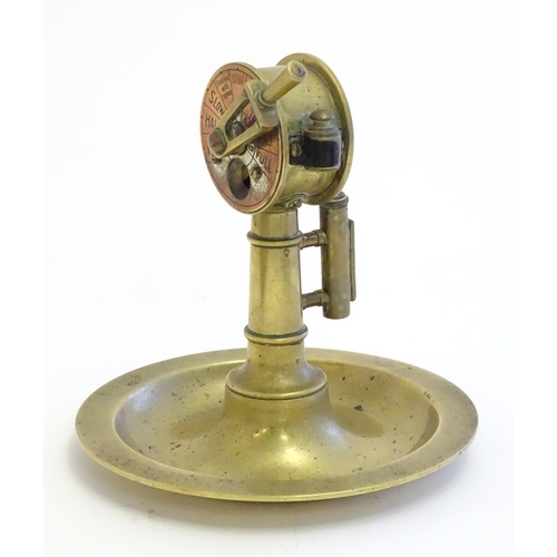 1180A - An early 20thC Continental novelty brass cigar / cheroot cutter and ashtray modelled as a nautical s... 