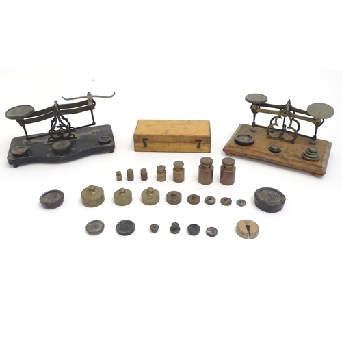 1197 - Late 19th / early 20thC postal scales with a quantity of assorted weights.