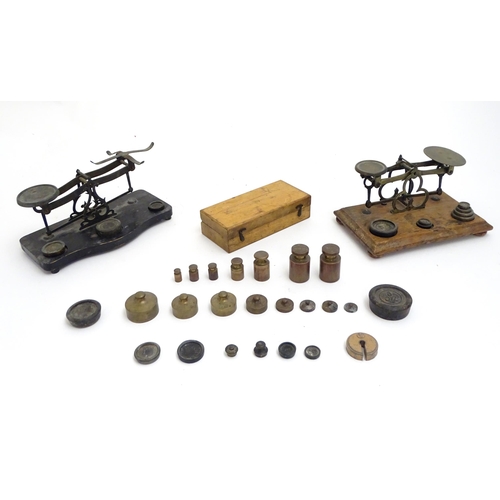 1197 - Late 19th / early 20thC postal scales with a quantity of assorted weights.