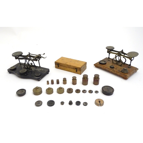 1197 - Late 19th / early 20thC postal scales with a quantity of assorted weights.