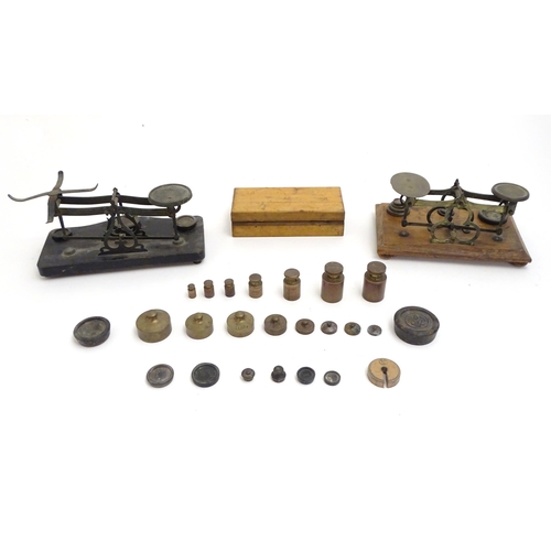 1197 - Late 19th / early 20thC postal scales with a quantity of assorted weights.